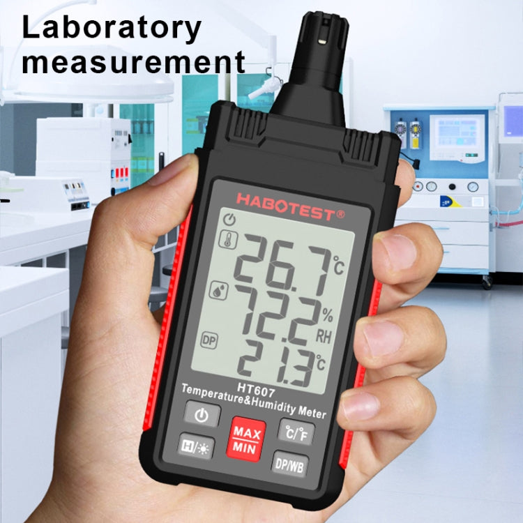Handheld temperature humidity meter held in hand with LCD temperature and RH values