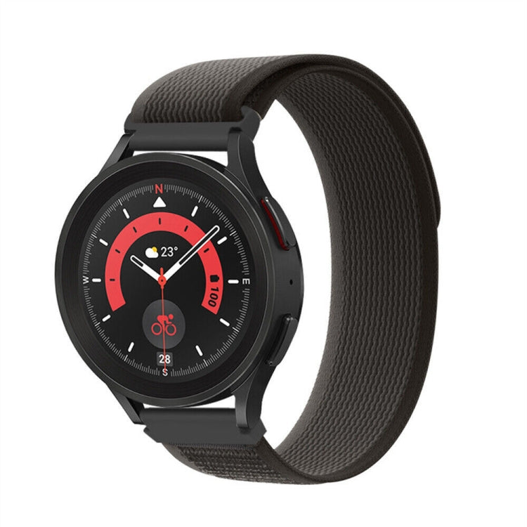 Black nylon loop watch band with textured weave and metal clasp, shown on watch