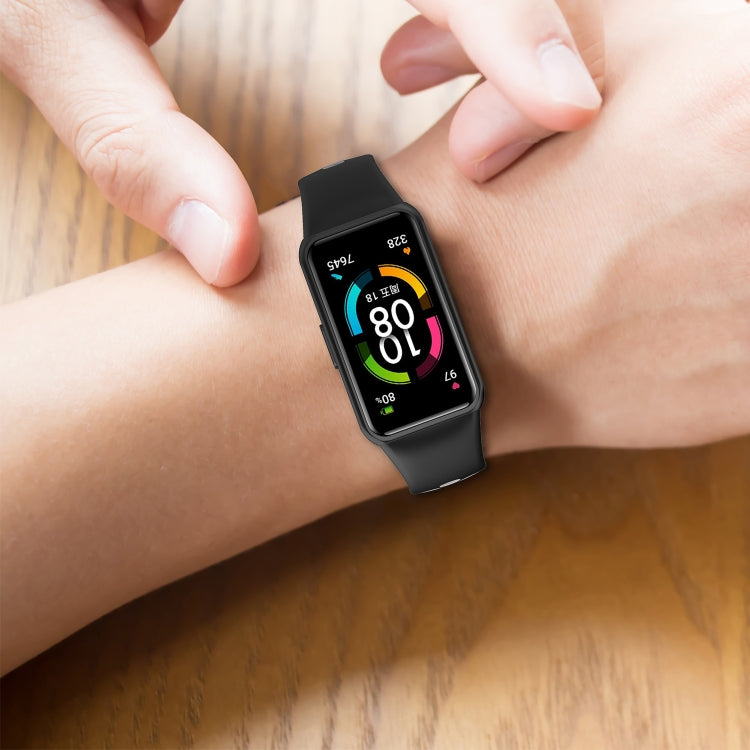 Two-color silicone watch band with reverse buckle on wrist, dark strap with perforated underside