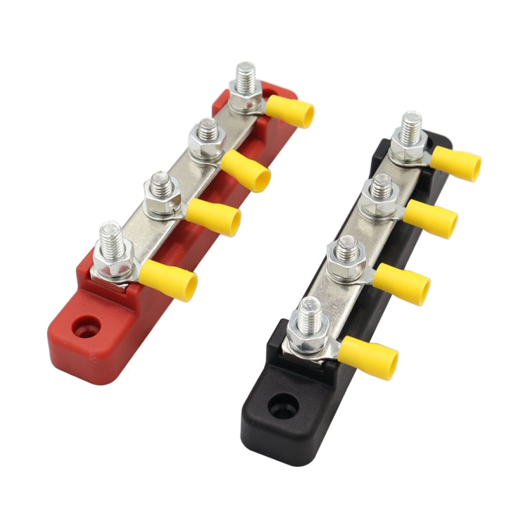 Two busbar terminal blocks in red and black, each with silver studs and multiple yellow connector caps