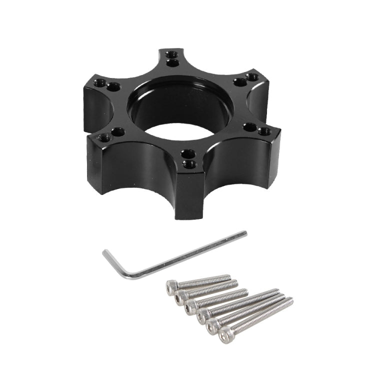 Black wheel hub adapter with center opening, allen key, and mounting screws