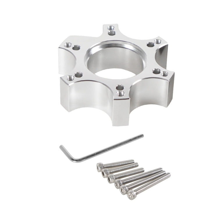 Silver wheel hub adapter with center opening, allen key, and mounting screws