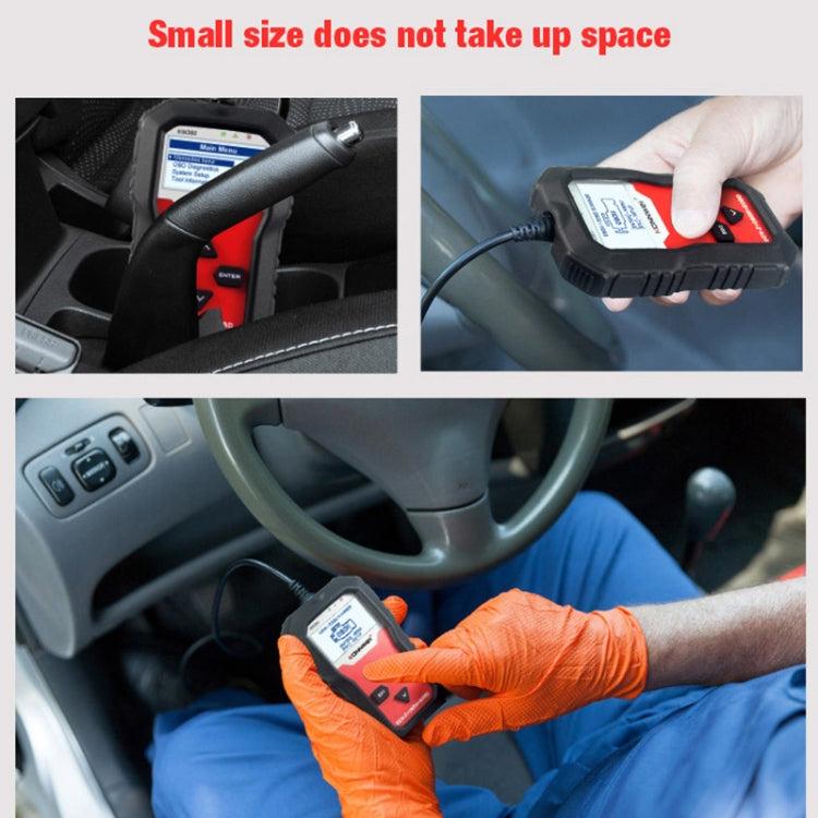 Compact OBD2 scanner being connected in a car interior, red/black handheld unit