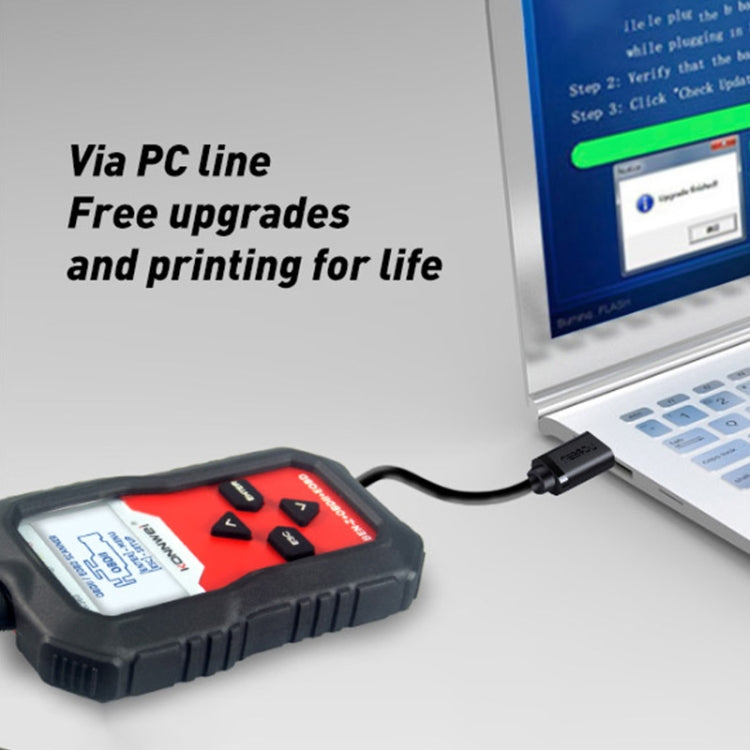 OBD2 scanner connected to a laptop for PC updates and printing
