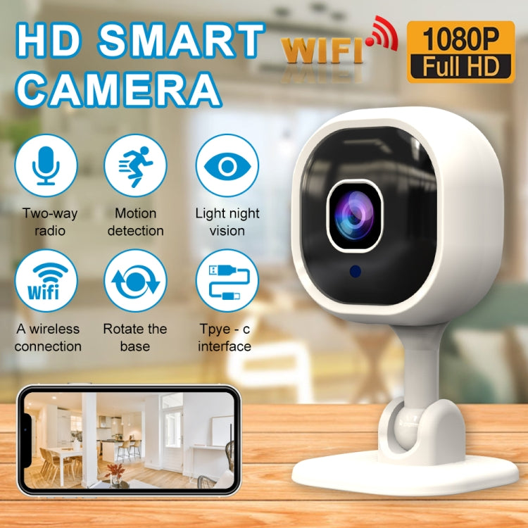 White indoor security camera on desktop stand with black lens window and indicator light
