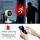 White indoor security camera on stand with black lens panel and blue status light