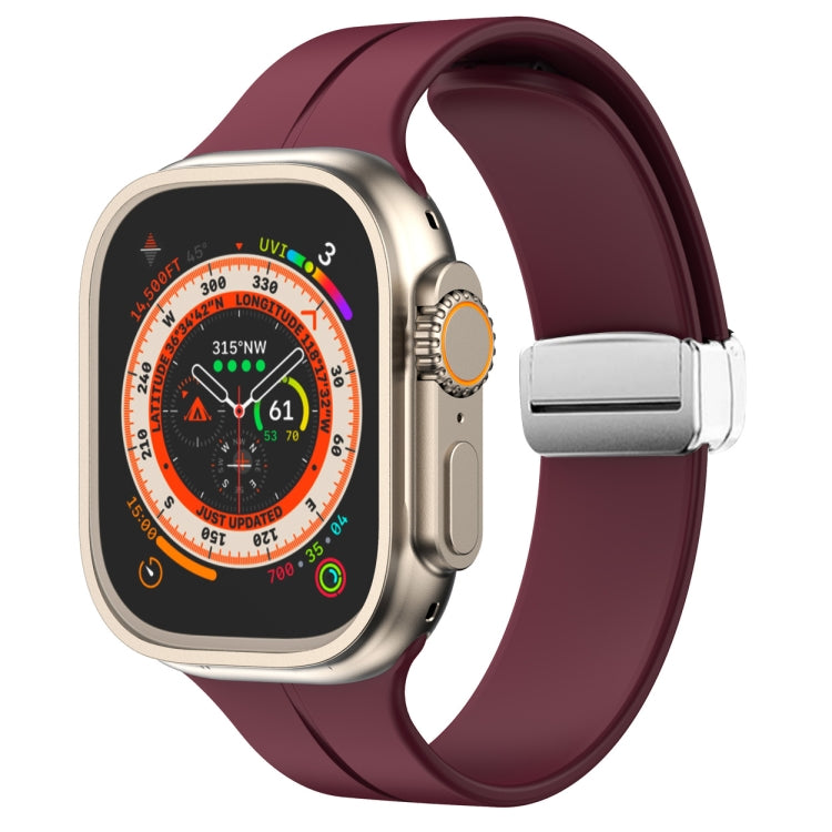 Purple silicone watch band with magnetic fold clasp for Apple Watch, side view.
