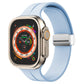 Light blue silicone watch band with magnetic fold clasp for Apple Watch, side view.
