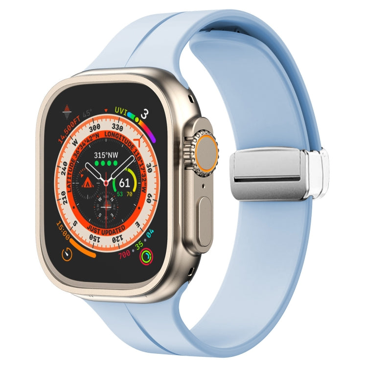 Light blue silicone watch band with magnetic fold clasp for Apple Watch, side view.