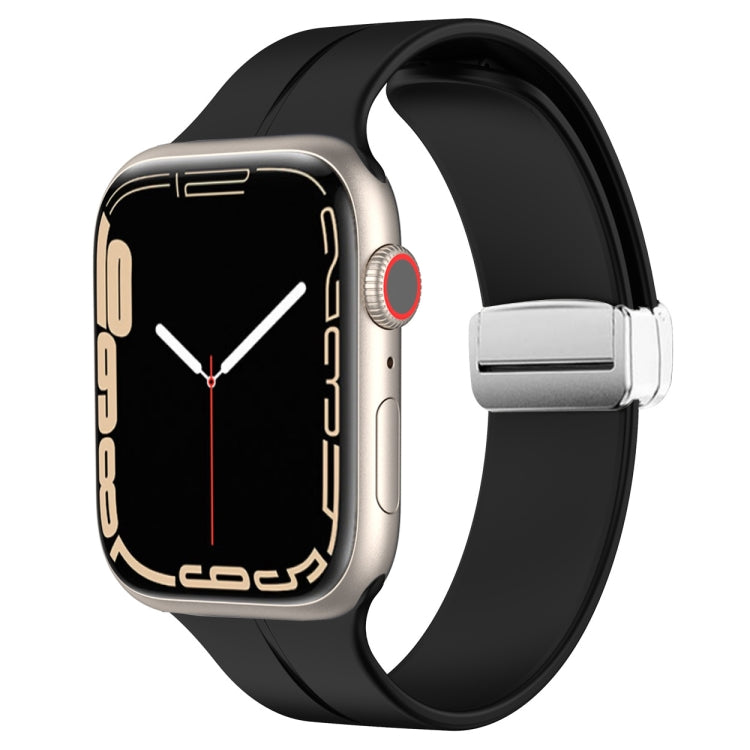 Black silicone magnetic fold clasp watch band with silver clasp hardware and loop