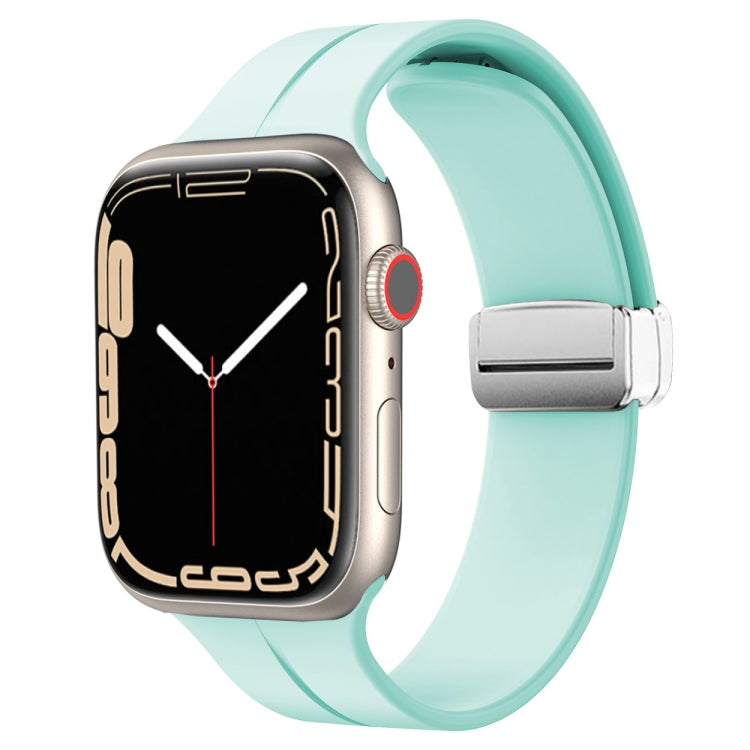 Light teal silicone watch band with magnetic fold clasp for Apple Watch, front view.