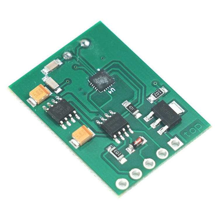 Diagonal view of green circuit board with IC chips, capacitors, and connectors