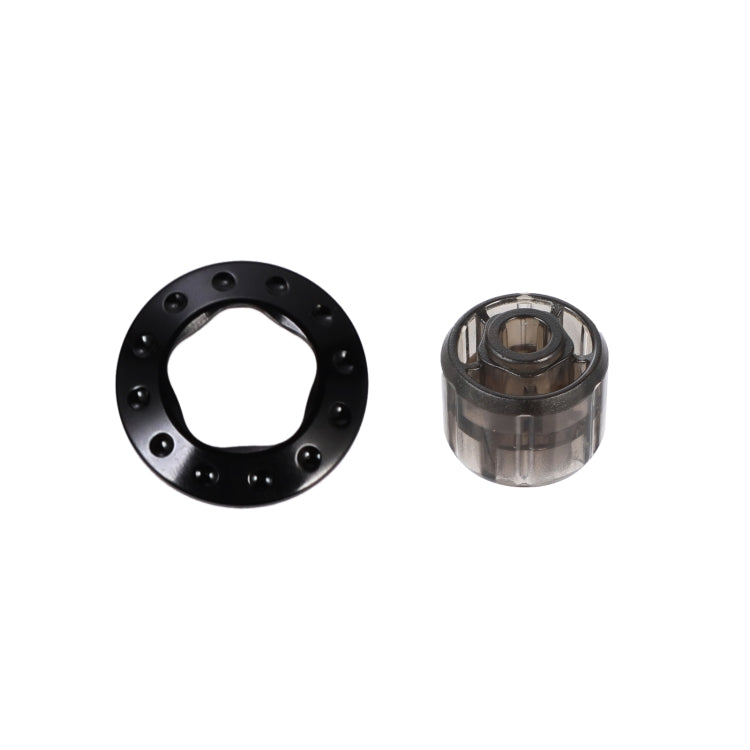 Black metal cap ring with five studs and included removal tool