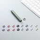 Assorted colored replacement cap rings with small metal removal tool and ring