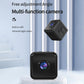Black mini WiFi security camera with visible front lens on a tabletop display
