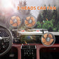 Three-head rotating car fan with orange grille, mounted on a dashboard