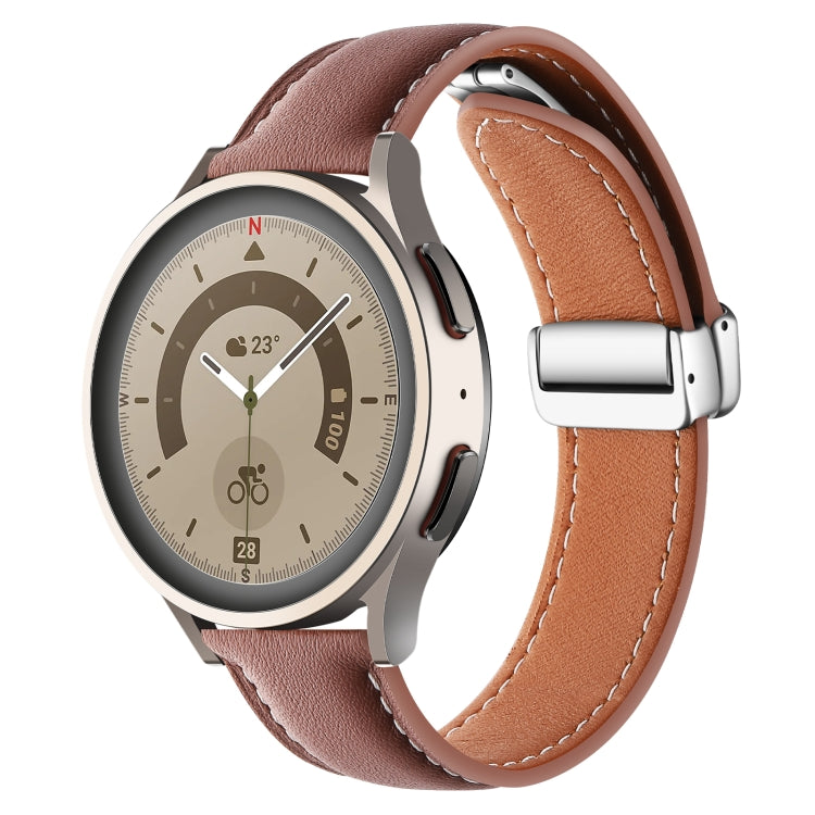Brown genuine leather watch band with folding buckle and silver hardware, close side view.