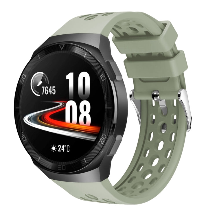 Silicone watch band with perforated holes, light green color and metal buckle