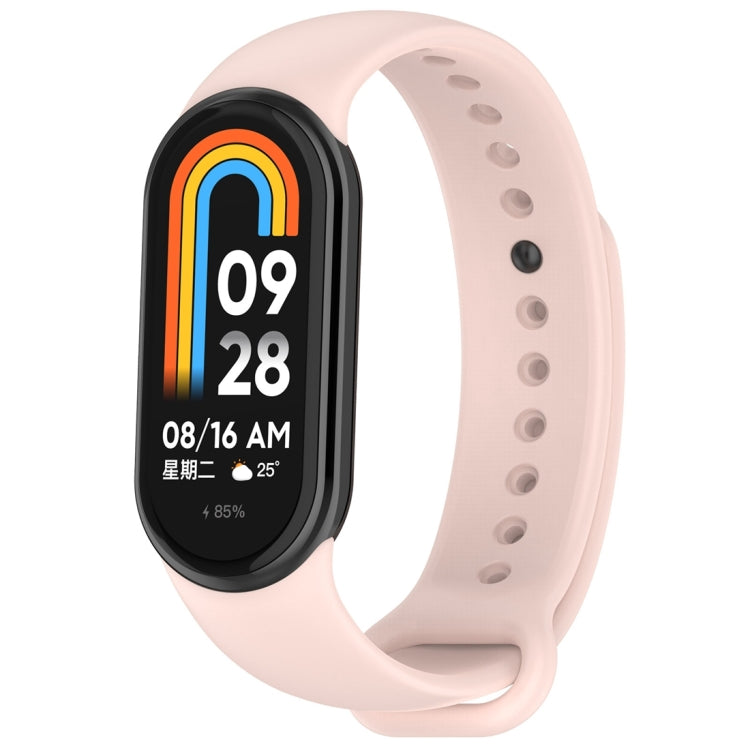 Light pink silicone smartwatch band with oval tracker body, perforated holes
