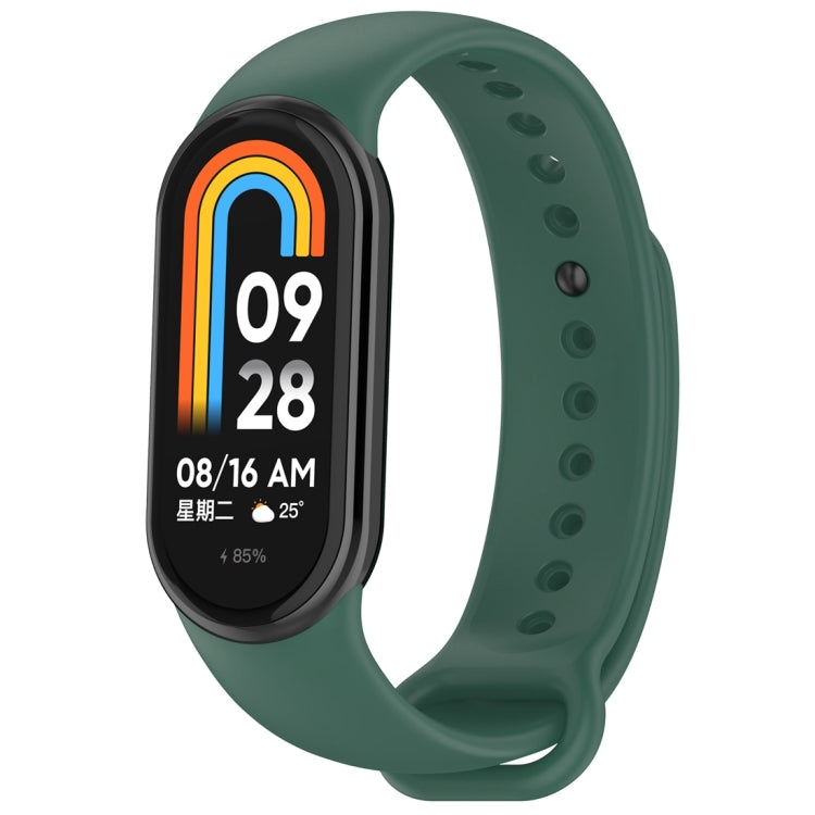 Dark green silicone smartwatch band with oval tracker body, perforated holes