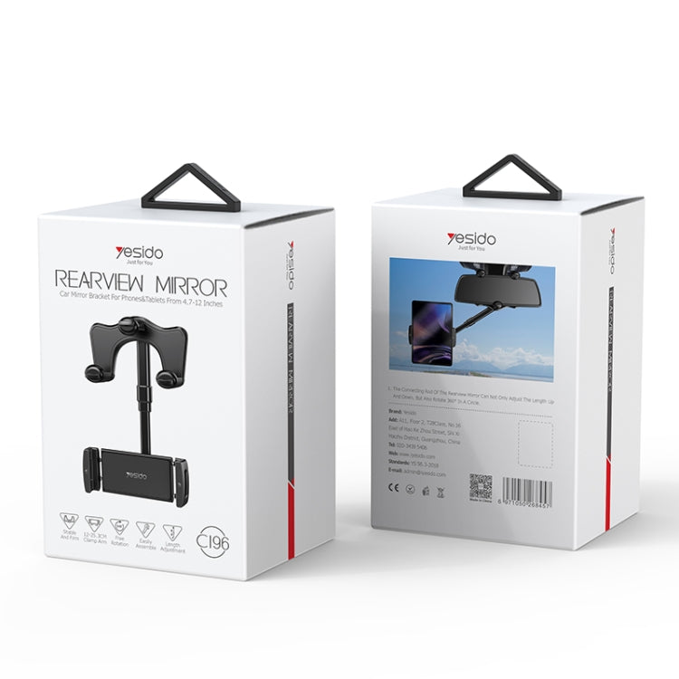Car rearview mirror with phone holder, shown in retail packaging box
