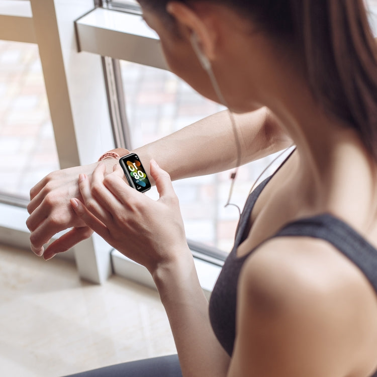 Black loop nylon smartwatch band on wrist, adjustable buckle