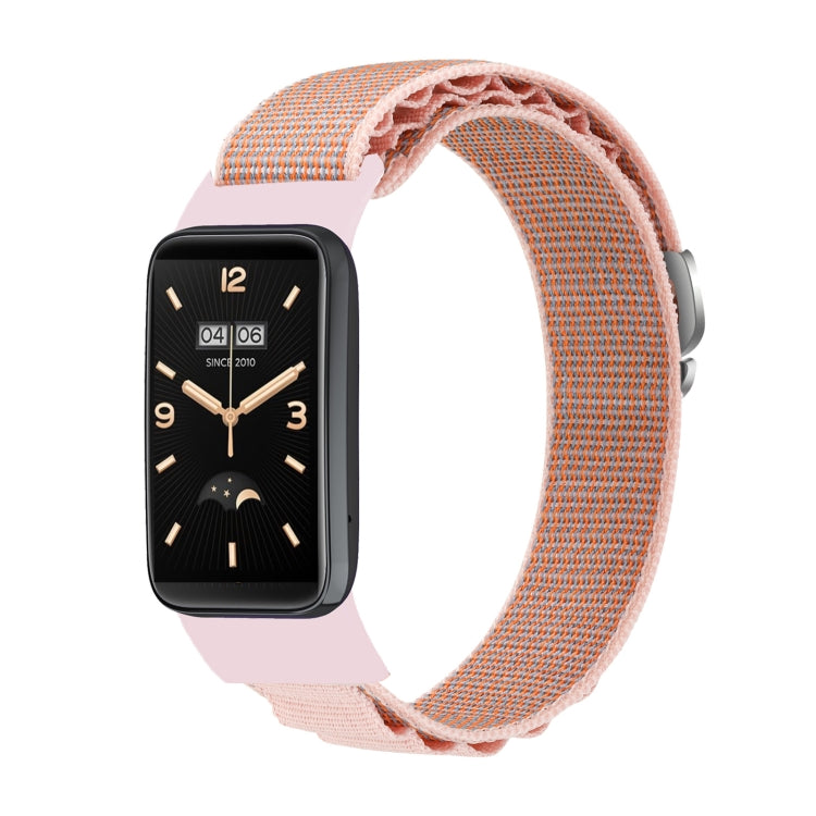 Loop nylon watch band in pink sand, woven strap with black smartwatch analog display