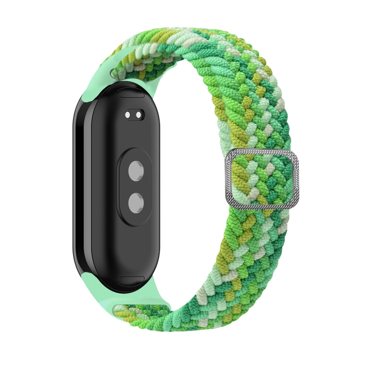 Adjustable braided elastic watch band in green and light green with adjustable metal clasp