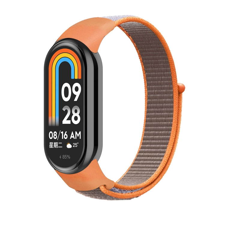 Loop nylon watch band with brown-orange strap and black smartwatch display