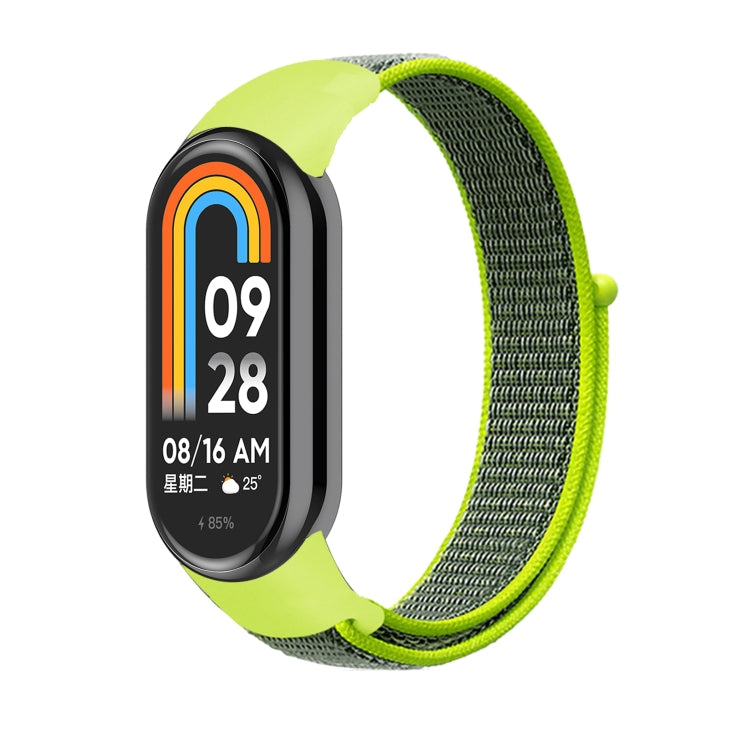 Lime green and dark green nylon loop watch band with small clasp, on smartwatch.