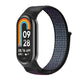 Navy blue nylon loop watch band with small clasp, fitted to a smartwatch frame.