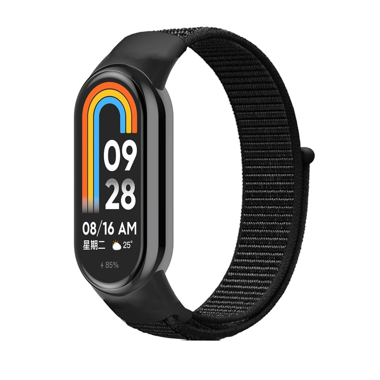 Black nylon loop watch band with small clasp, attached to a smartwatch frame.