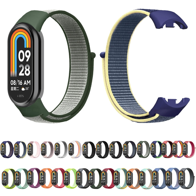 Two loop nylon watch bands: green and navy with yellow trim, smartwatch faces