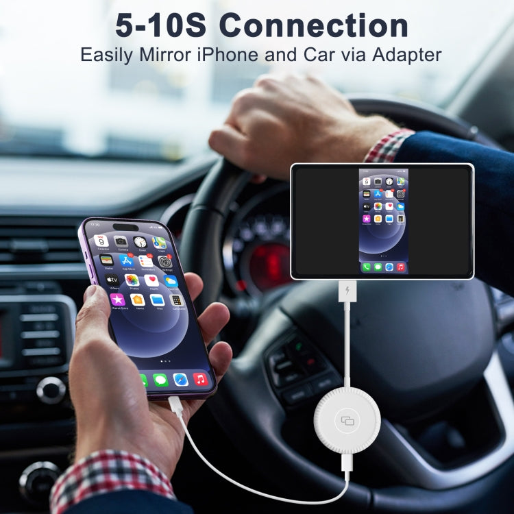 Car interior with white CarPlay mirror adapter puck and connected smartphones