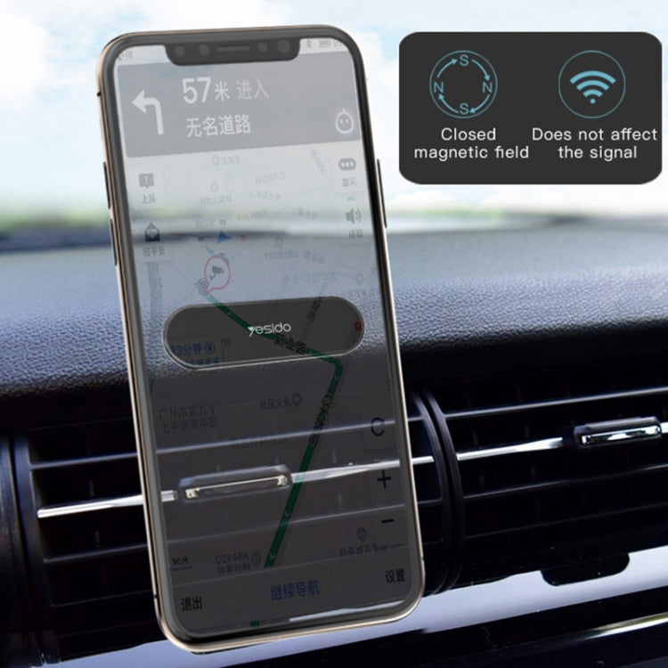 Smartphone mounted using a black magnetic car phone holder on dashboard