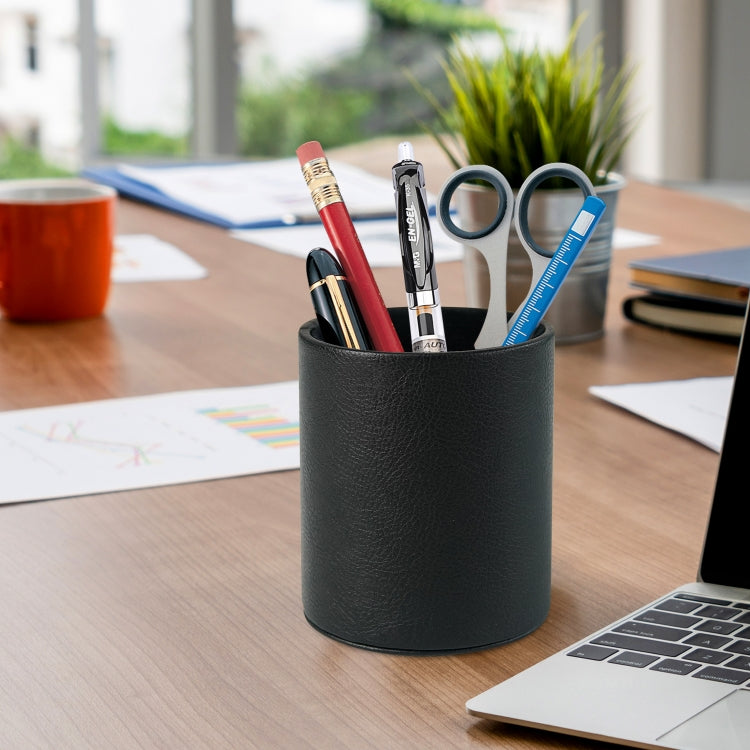Dark green PU leather pen holder cup holding pens, scissors, and tape on desk
