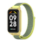 Green mesh nylon loop watch band with gold metal watch case and clasp