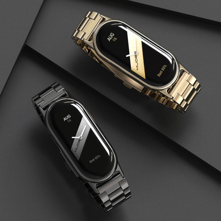 Gold and black three-bead stainless steel watch bands with metal link straps, on watches