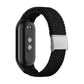 Black braided nylon watch band with adjustable steel buckle and silver clasp