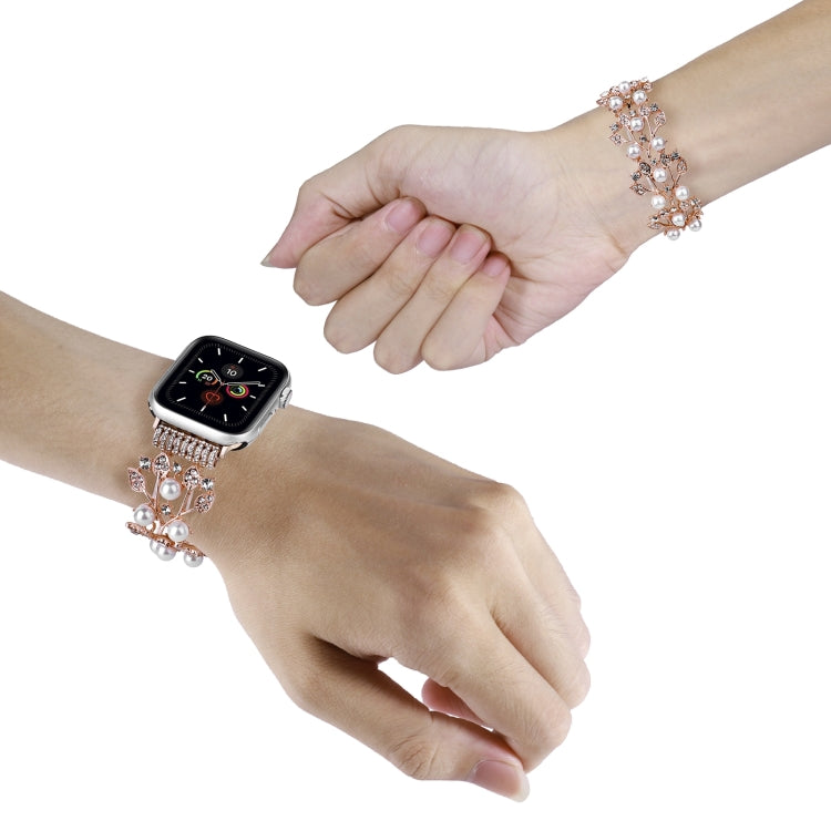 Four-leaf beaded metal watch band in rose gold with pearl beads on wrist