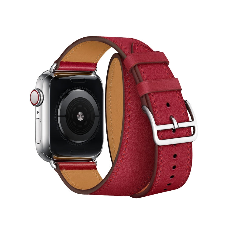 Red leather watch strap with double loop, silver buckle, and punched adjustment holes