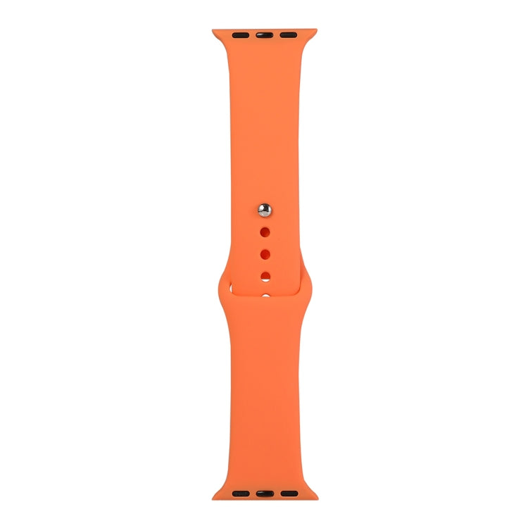 Orange silicone watch replacement strap long section with pin holes and metal buckle tabs