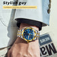 Two-tone men’s quartz watch with blue dial and gold crown on stainless link bracelet