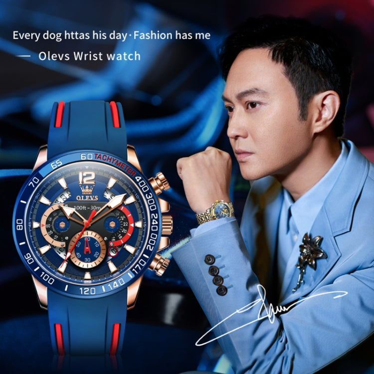 Blue silicone sports quartz chronograph watch on wrist with silver case and red bezel accents