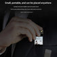 Mini HD recorder pen camera held near pocket fabric, compact dark gray design