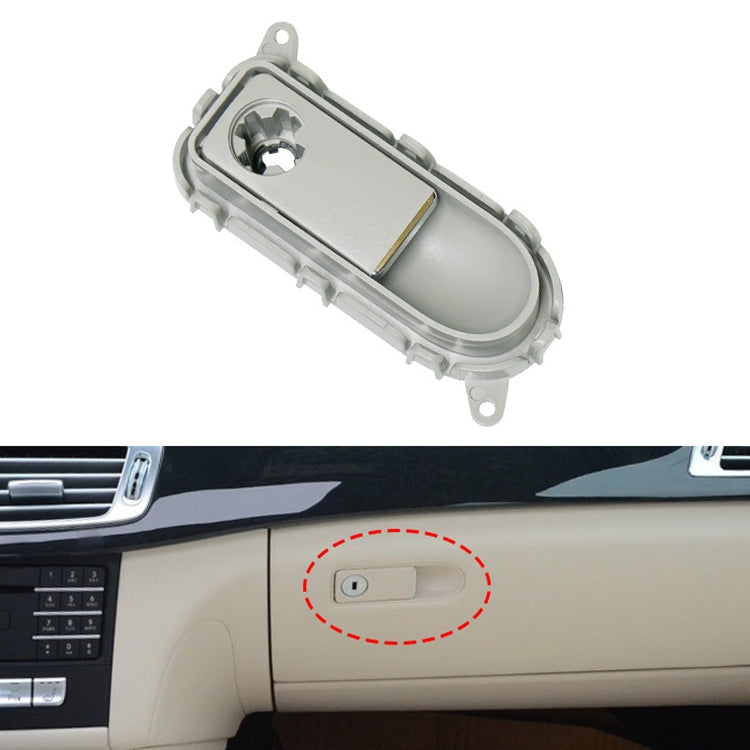 Grey glove box handle switch panel with oval button opening and mounting tabs