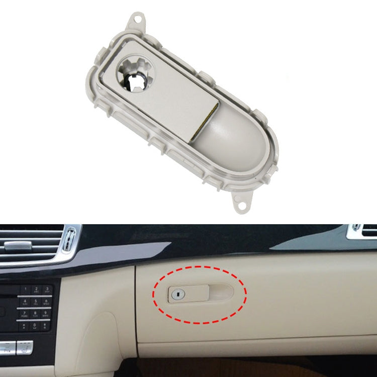 Light grey glove box handle switch panel with oval button opening and mounting tabs