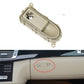 Beige glove box handle switch panel with oval button opening and mounting tabs