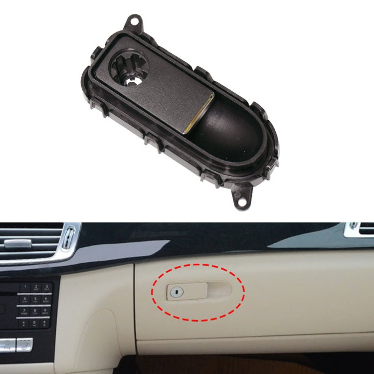 Dark black glove box handle switch panel with oval button recess and mounting tabs