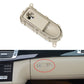 Cream glove box handle switch panel with oval button recess and mounting tabs